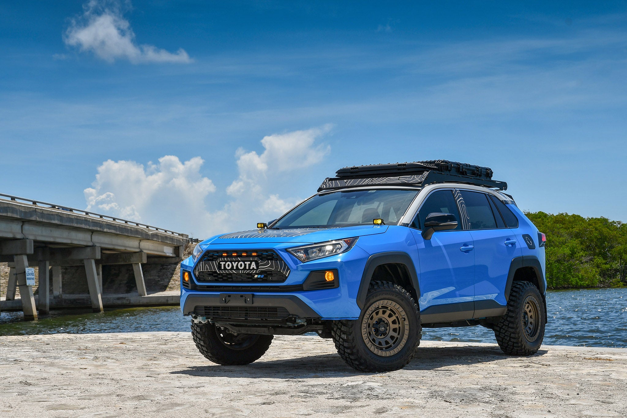 overland sector wheels rig gallery kj's toyota rav4 off-road trail on 17x9 satin bronze venture wheels 3 inch lift 32 inch tires custom bumper roof rack roof cases on water