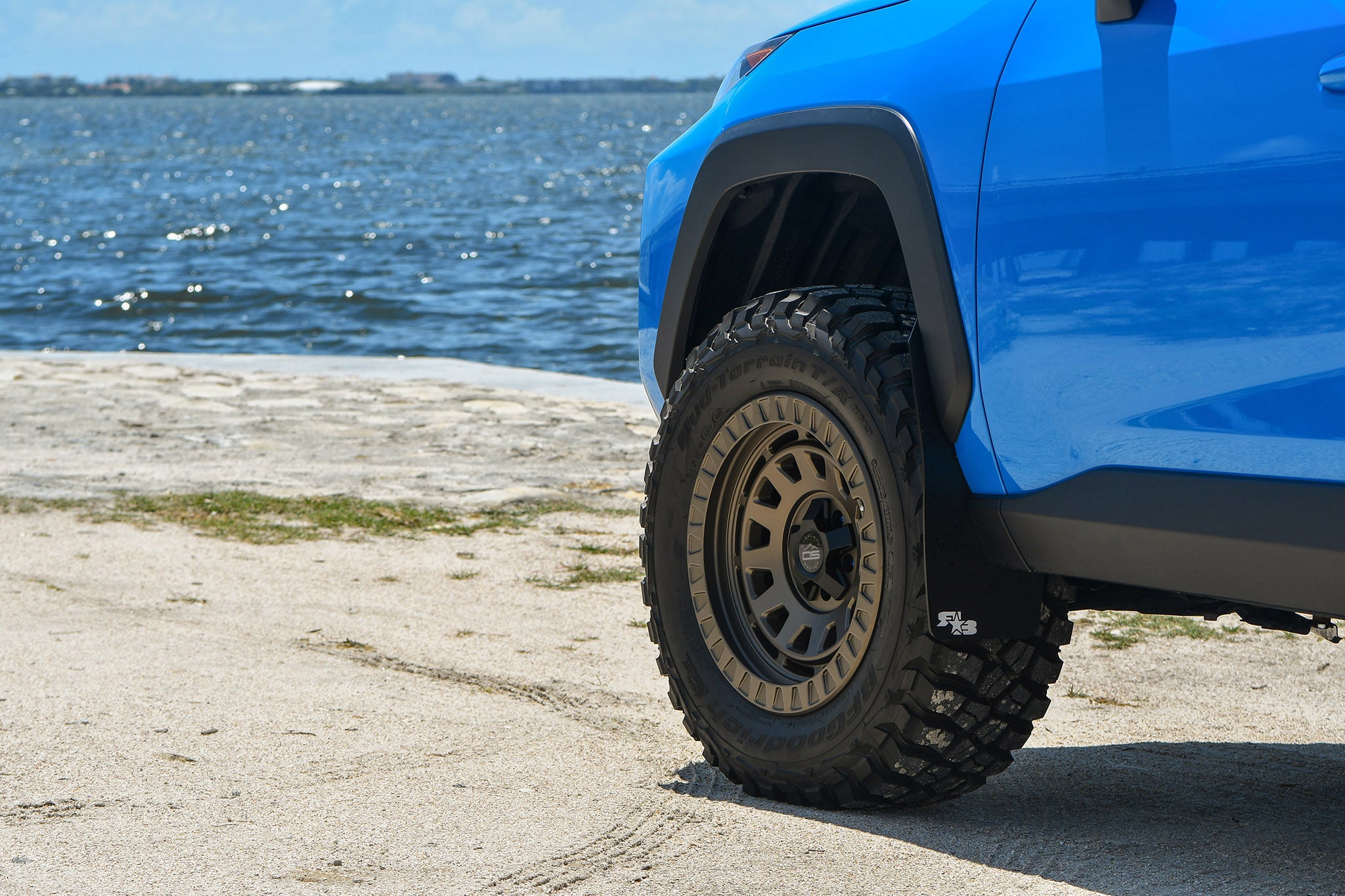 overland sector wheels rig gallery kj's toyota rav4 off-road trail on 17x9 satin bronze venture wheels 3 inch lift 32 inch tires custom bumper roof rack roof cases on water