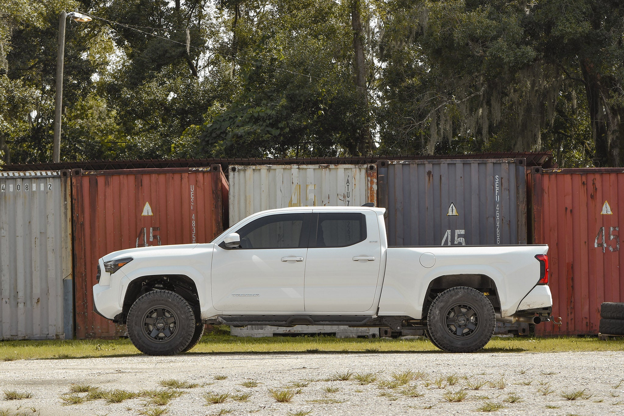 Toyota Tacoma on overland sector atlas black offroad overland wheel 17 inch