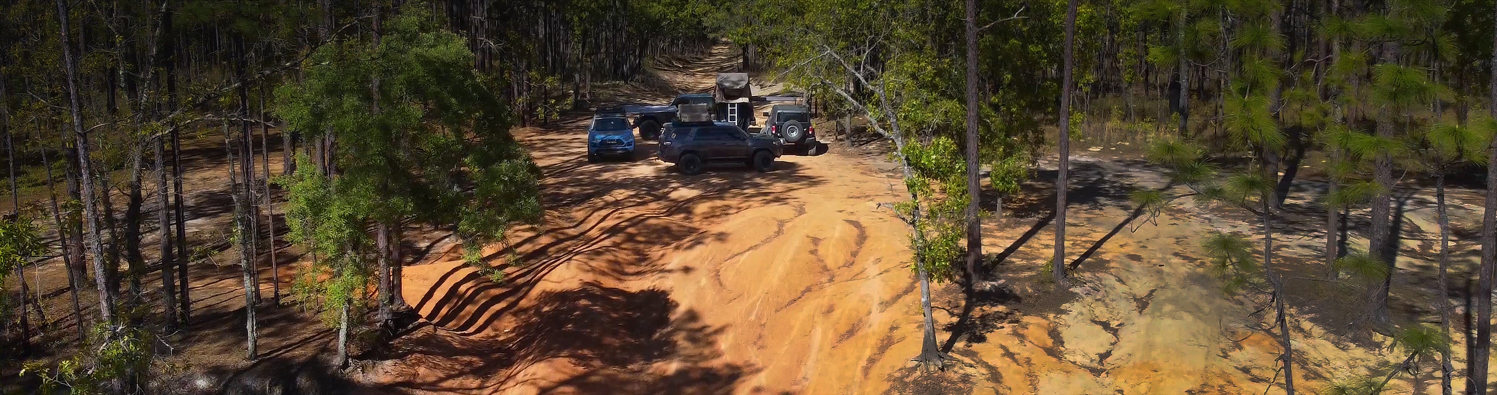 overland sector wheels off-road four vehicles on the trail toyota 4runner toyota rav4 ford bronco jeep gladiator mojave clay dirt trail