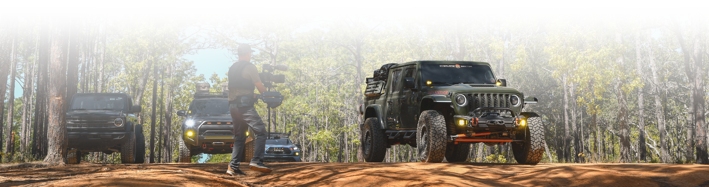 overland sector wheels jeep gladiator on venture at top of hill offroad
