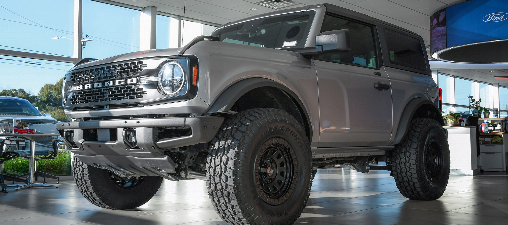 overland sector wheels ford bronco 2 door on 17x9 satin black venture wheels on showroom floor at ford dealership