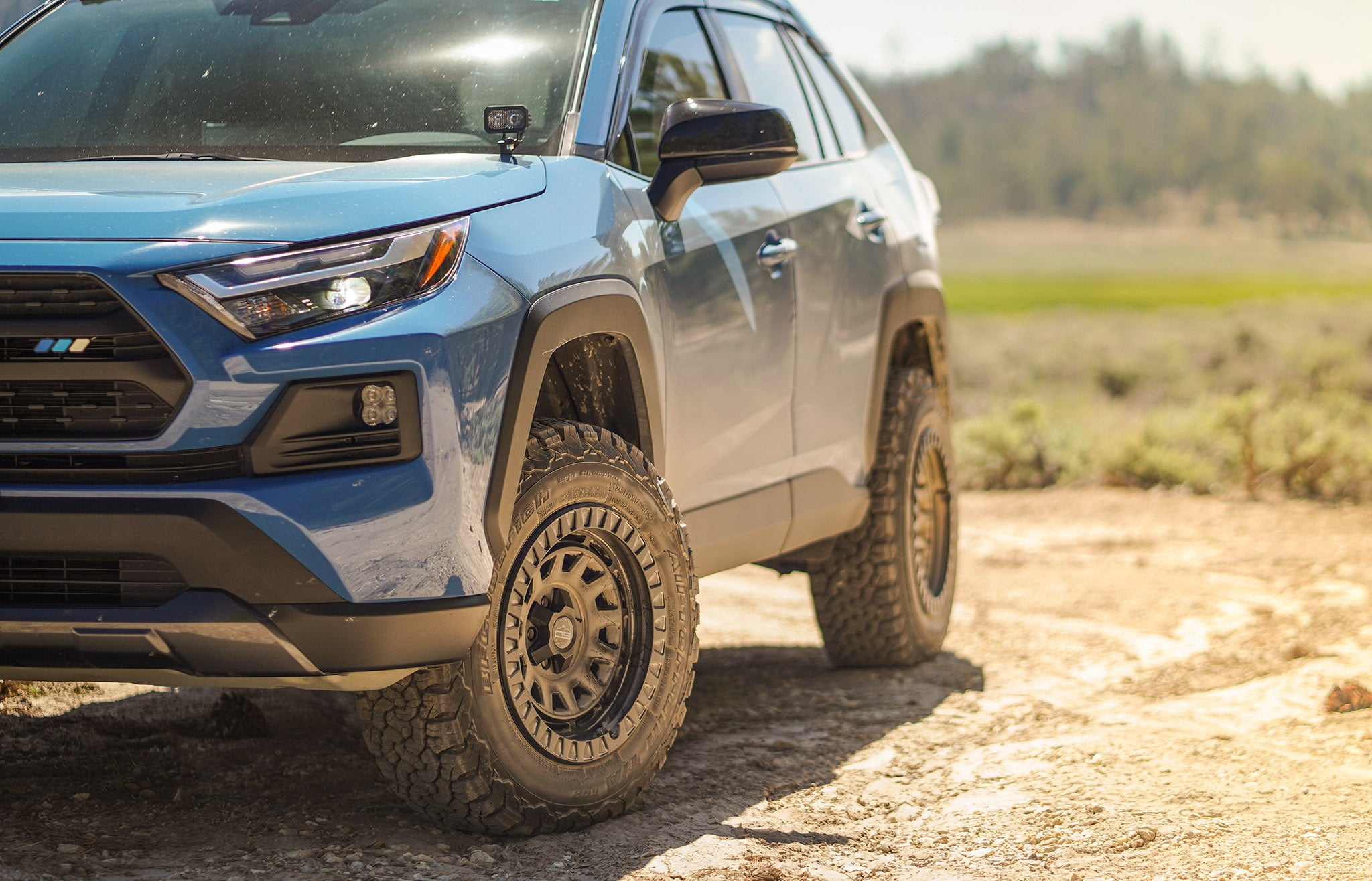 overland sector wheels toyota rav4 trd on 17x9 satin black venture wheels on dirt trail upclose