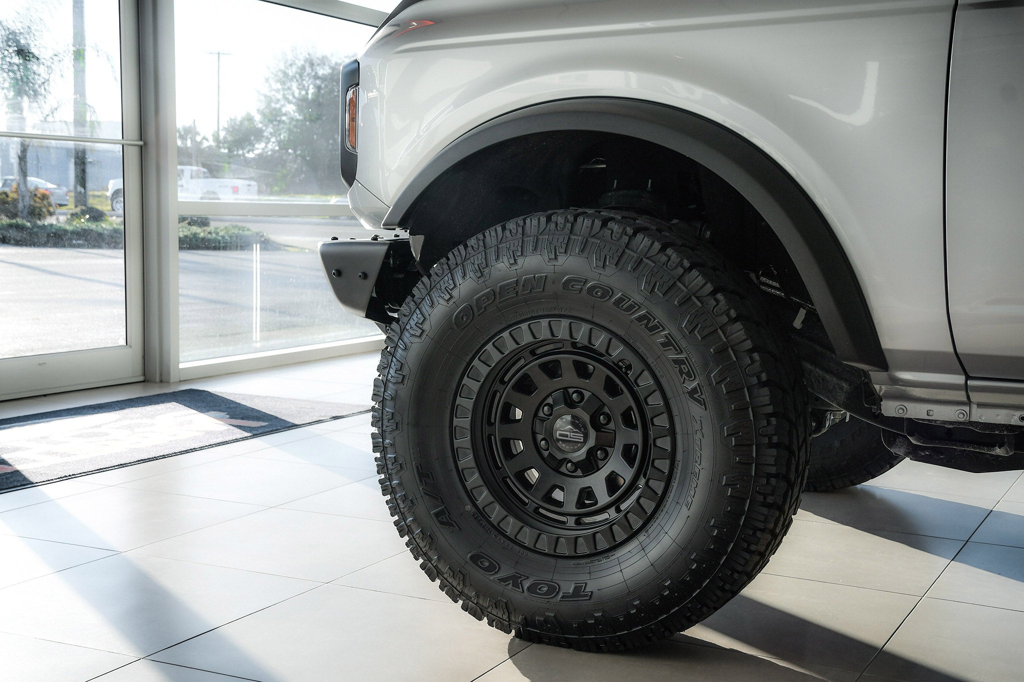 overland sector wheels ford bronco 2 door on 17x9 satin black venture wheels on showroom floor at ford dealership up close