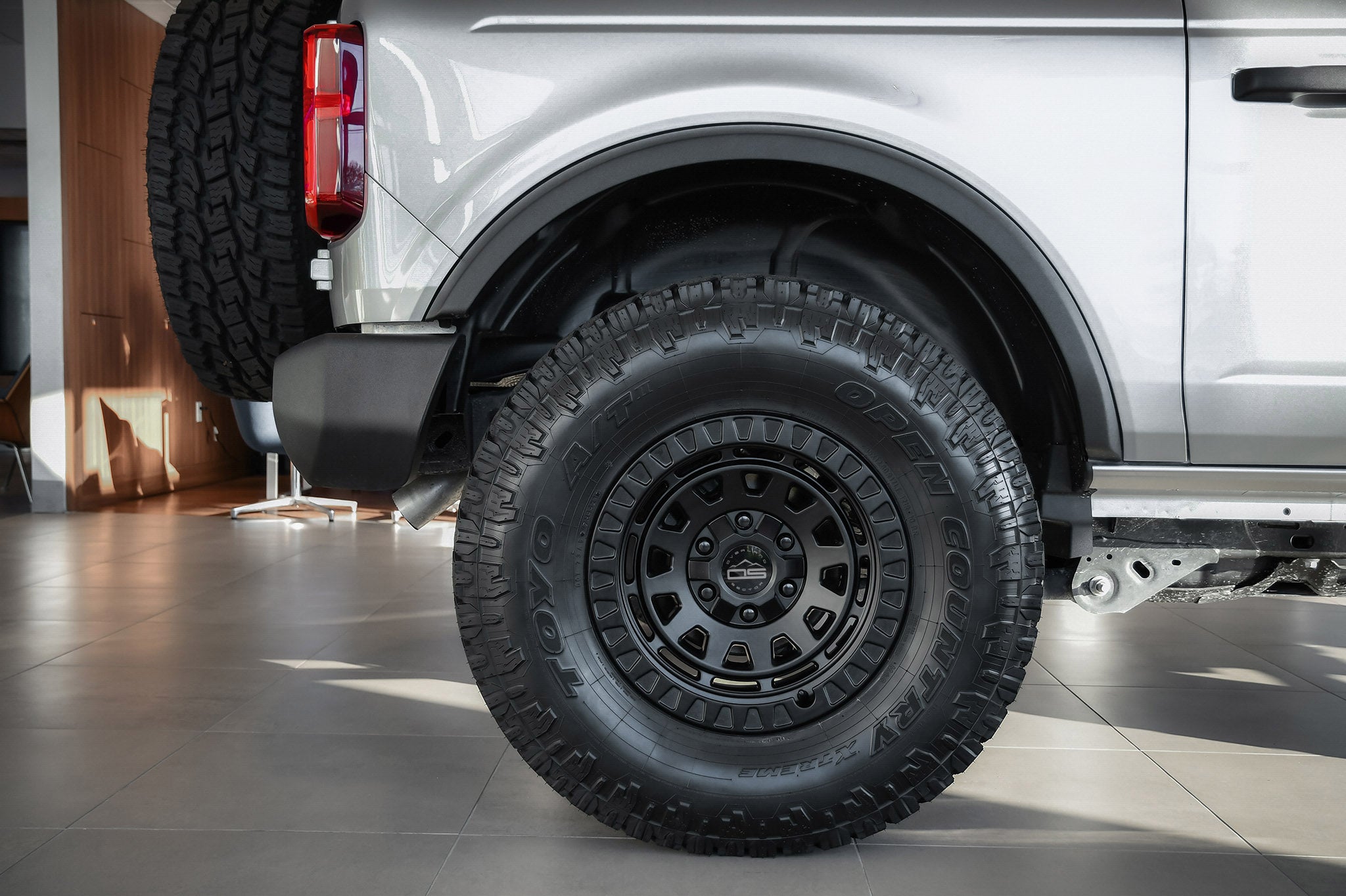 overland sector wheels ford bronco 2 door on 17x9 satin black venture wheels on showroom floor at ford dealership up close