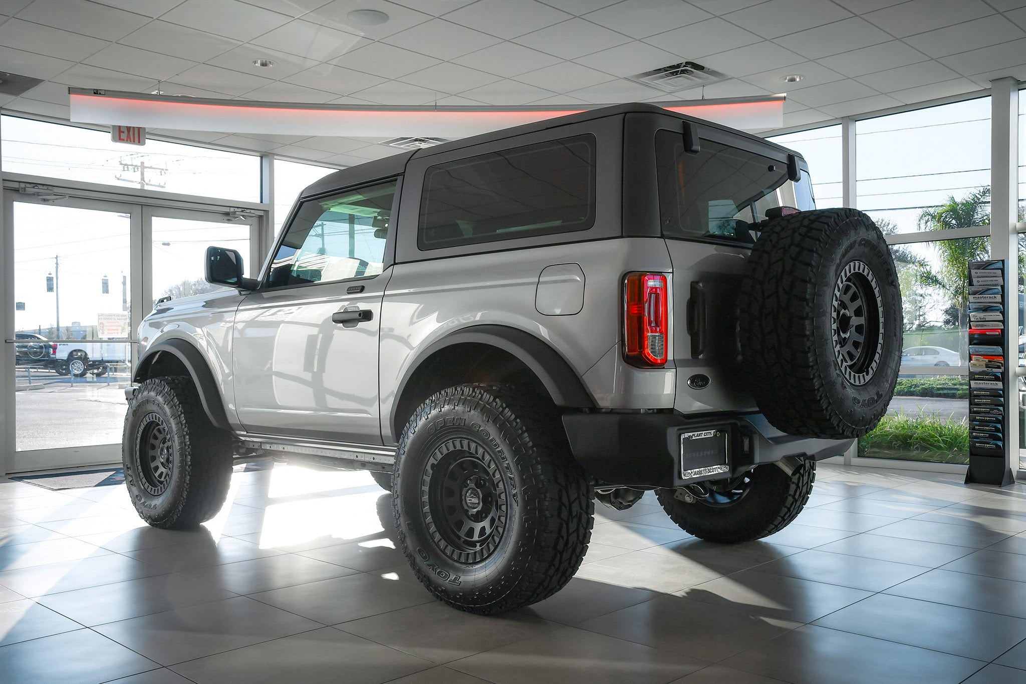 overland sector wheels ford bronco 2 door on 17x9 satin black venture wheels on showroom floor at ford dealership up close