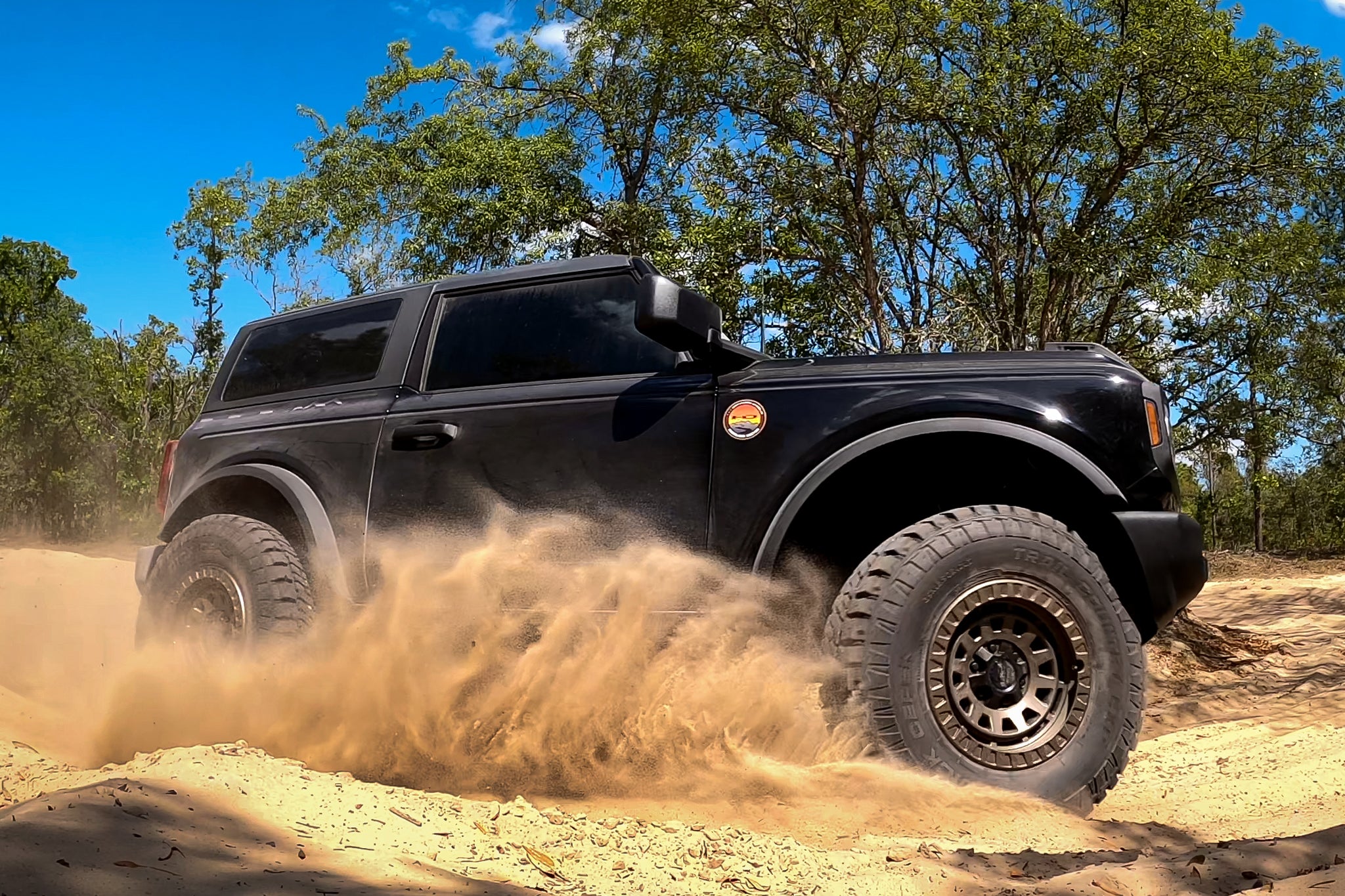 overland sector wheels ford bronco slinging sand turning driving fast on satin bronze venture