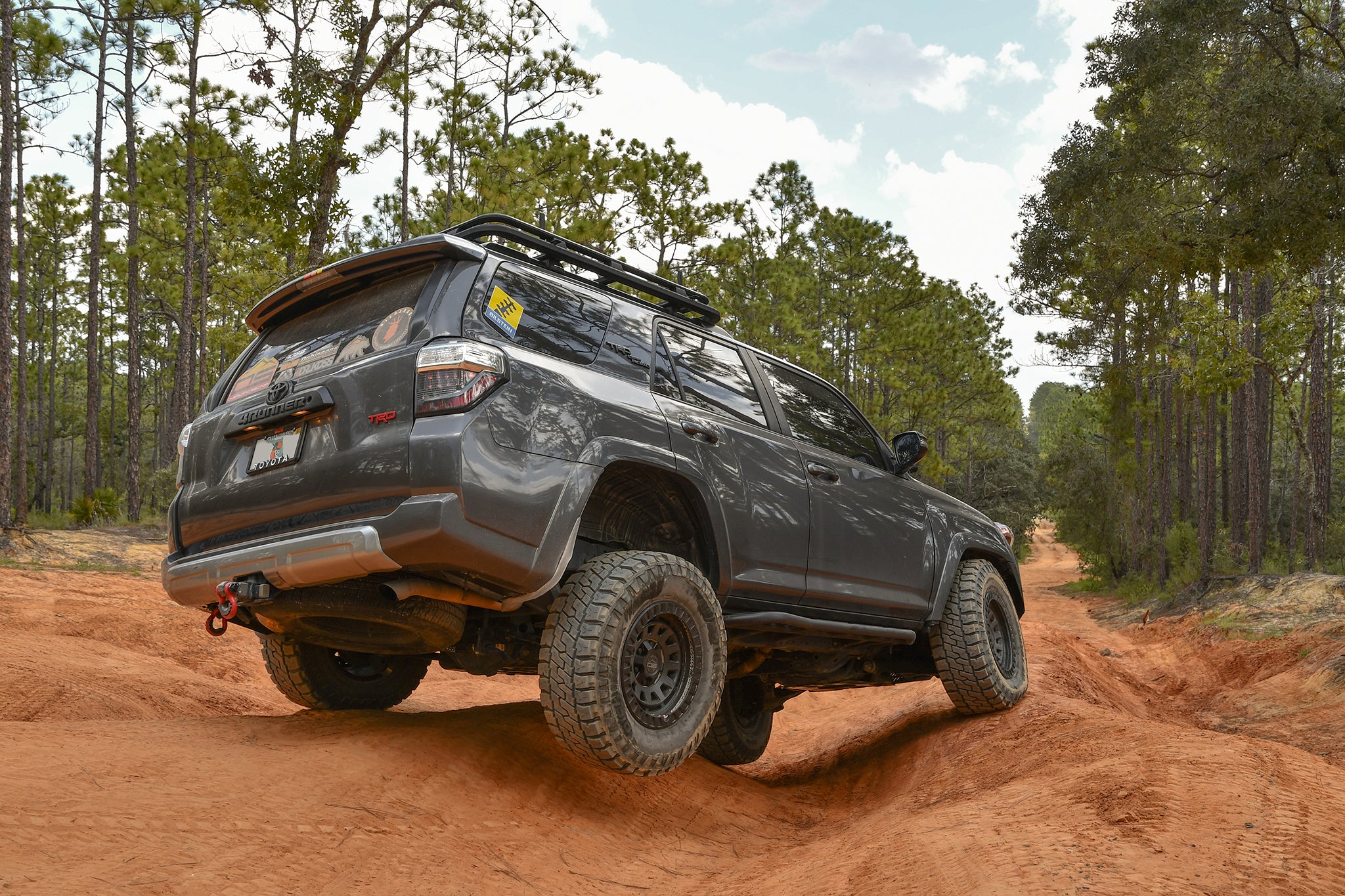 overland sector wheels toyota 4runner trd off-road on 17x9 satin black venture wheels on red dirt clay trail in woods